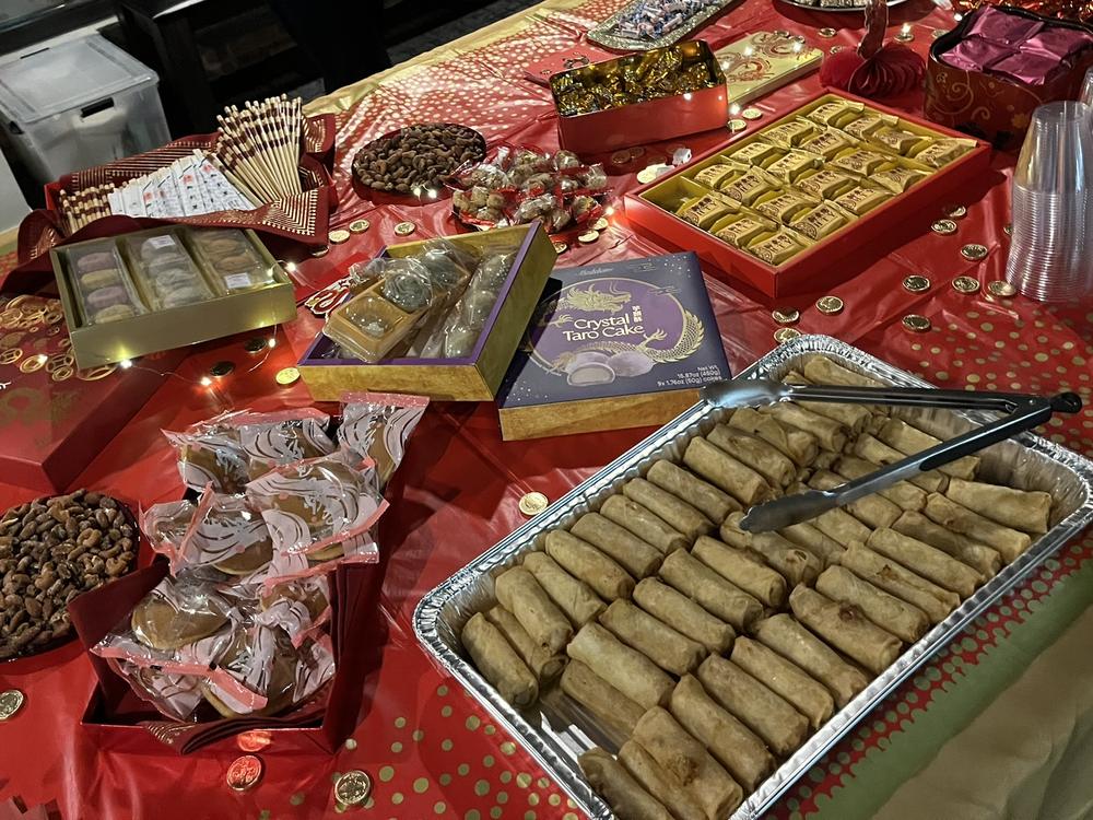 Lunar New Year celebration spread — spring rolls, sweets, and traditional treats in the Mezzanine Lounge